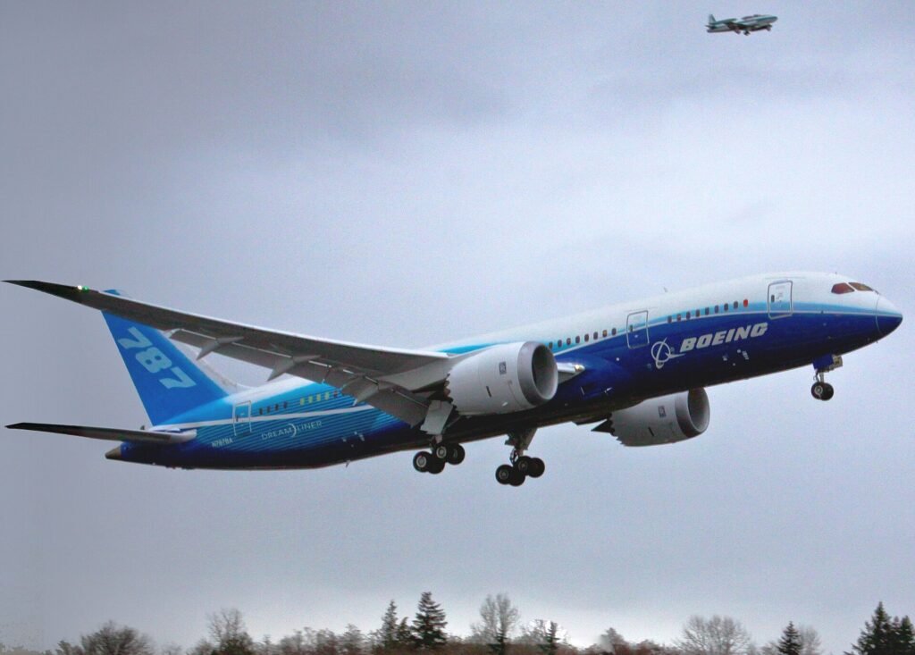 A Boeing 787 Dreamliner lifting off a runway with its landing gear retracting