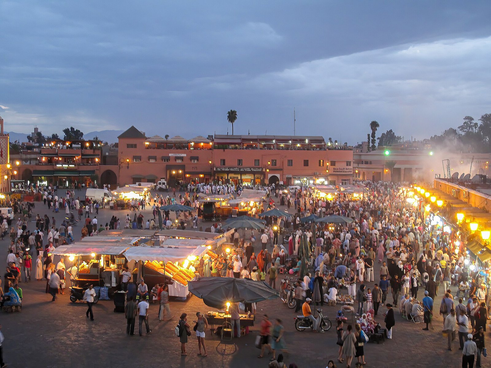 Crowds and food stalls in Jemaa el-Fnaa square in Marrakech at dusk