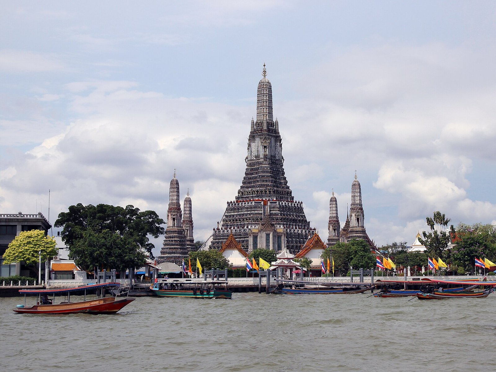 Wat Arun temple on the Chao Phraya river in Bangkok at dusk